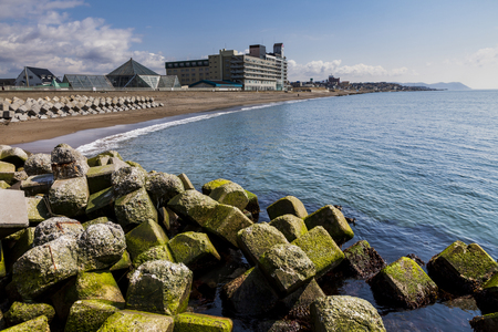 Hakodate in Hokkaido, Japan-April, 2 nd 2017: Waveside blocks and the coastal hotelのeditorial素材