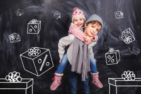 Boy and girl with a coupon boxesの写真素材