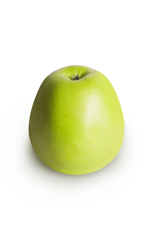 Green Apple on white background with spineの写真素材