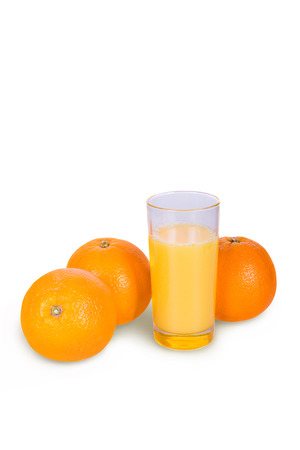 A glass of fresh orange juice on a white backgroundの写真素材