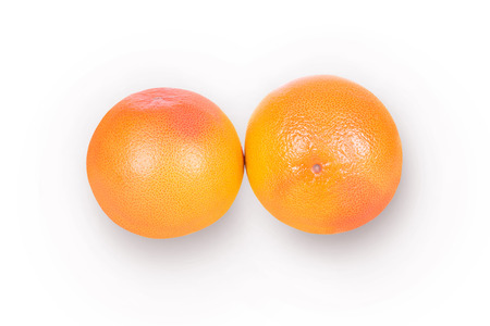 Two large ripe grapefruit on a white backgroundの写真素材
