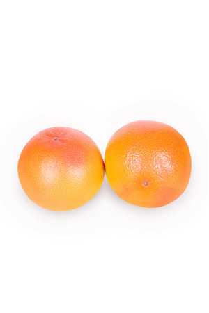 Two large ripe grapefruit on a white backgroundの写真素材