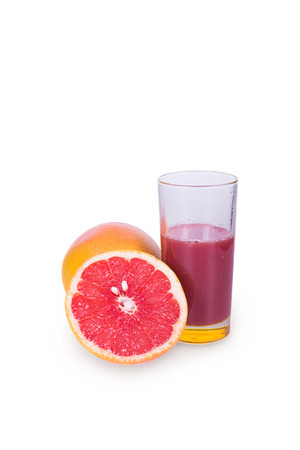 Juicy and ripe grapefruit near Frechet cup on a white backgroundの写真素材