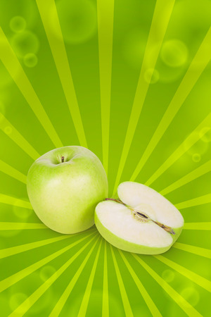 Green apple and half apple beside him on white backgroundの写真素材