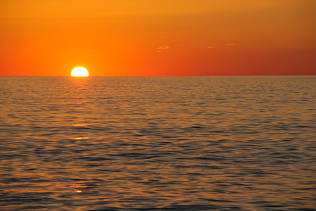 Wonderful sunset over the sea in bright colorsの写真素材