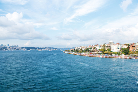 A beautiful city on the banks of the river with ships and touristsの写真素材