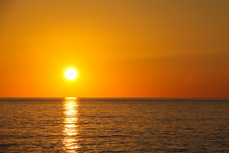 Wonderful sunset over the sea in bright colorsの写真素材