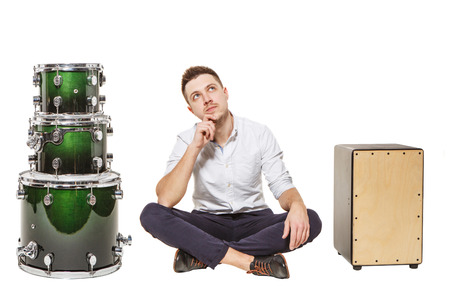 Guy sits and chooses what is best, or Cajon Drumsの写真素材