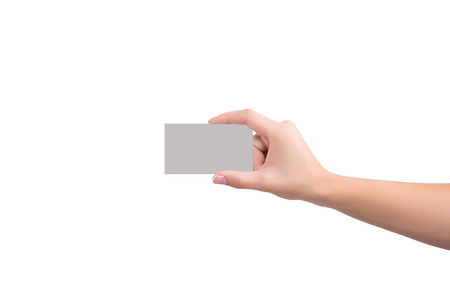 Business card in hand on white backgroundの写真素材
