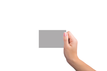 Female hand with a blank card isolated on whiteの写真素材