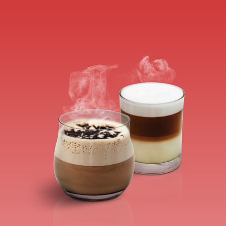 Cappuccino and Latte isolated on red backgroundの写真素材