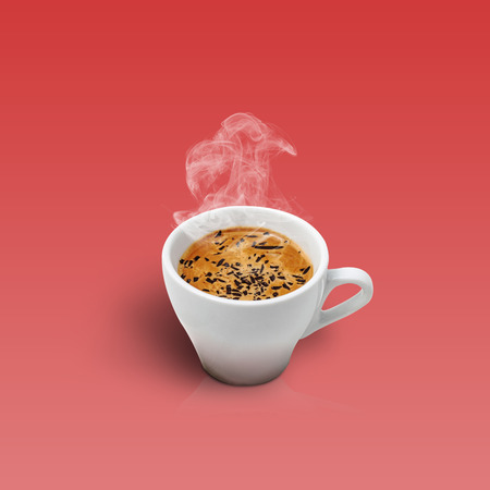 Cup of coffee isolated on red backgroundの写真素材