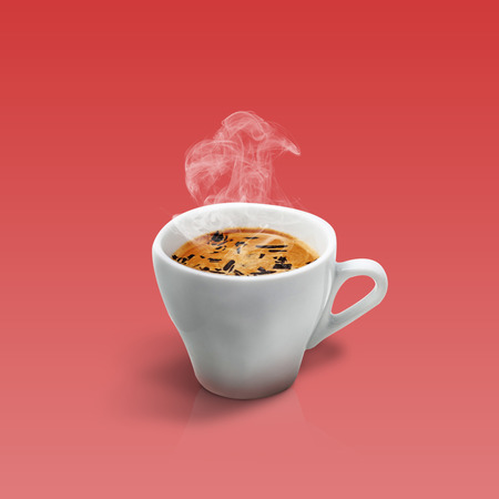 Cup of coffee isolated on red backgroundの写真素材