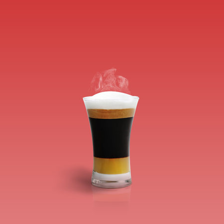 Mocha coffee isolated on red backgroundの写真素材