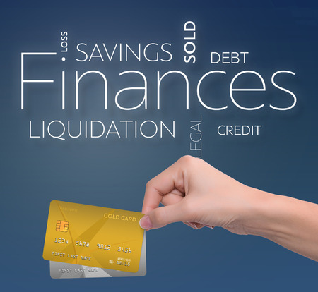 Business text on blue background with two credit cardの写真素材