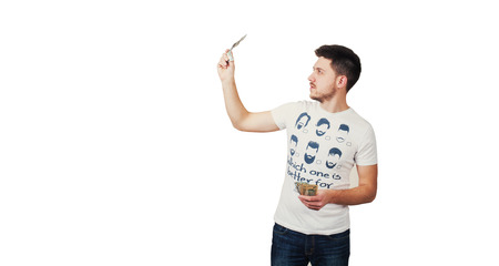 Man in T-shirt checks moneyの写真素材
