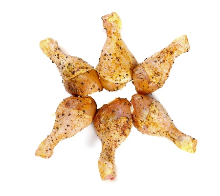 Six pickled chicken legs in star shape isolated on white.の写真素材