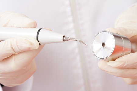 Periodontal ultrasonic scalers are dental instruments used primarily in the prophylactic and periodontal care of human teeth - changing head.の写真素材