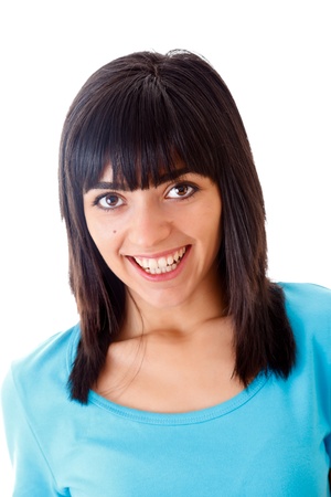 Portrait of a beautiful brunette girl smiling and looking directly into the camera - fully straightened hair series.の写真素材