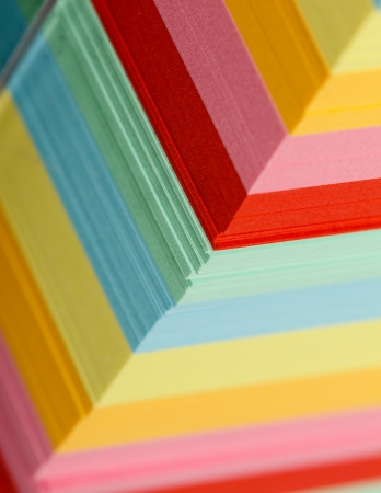 Closeup view of a block of colorful sticky notes.の写真素材