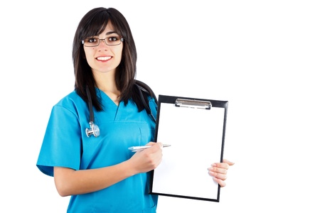 Kind brunette woman doctor/nurse in blue coat showing on her chart.の写真素材