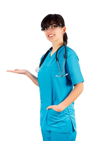 Beautiful brunette doctor holding or showing medical product isolated on white.の写真素材