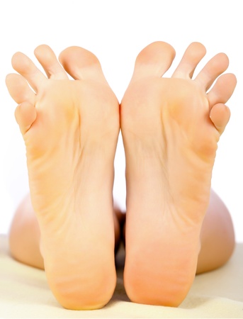 Clean and healthy woman feet isolated on white.の写真素材