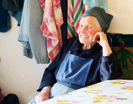 Elderly woman smiling kindly while telling a story. の写真素材