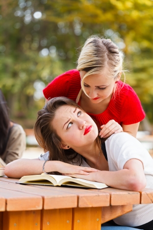 Cute woman with books just woke up.の写真素材