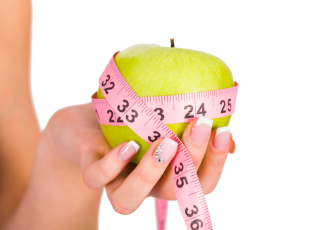 Fruit and measure tape as concepts of diet and healthy Life.の写真素材