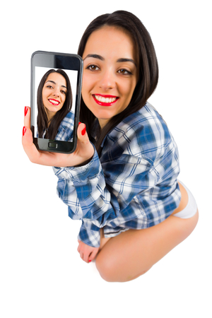 Beautiful lady making photos of herself - selfie.の写真素材