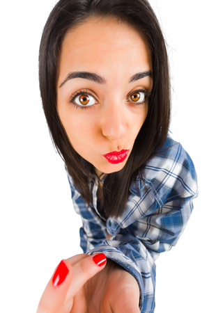 Beautiful girl making duckface while taking a selfie.の写真素材
