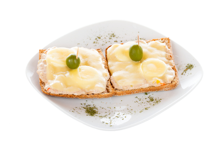 Freshly made tuna maionnaise sandwitches with cheese and boiled eggs isolated on white.の写真素材