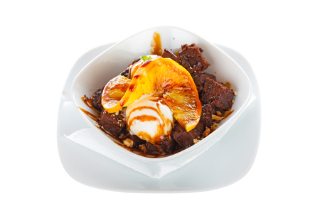 Tansty dessert special with brownies and vanilla icecream with strawberry topping.の写真素材