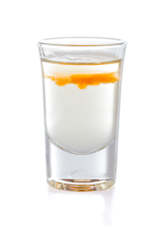 Delicious cocktail shot made of anise liqueur, tabasco sauce and tequila.の写真素材
