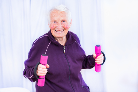 Elderly woman training her body, not letting herself get weak.の写真素材