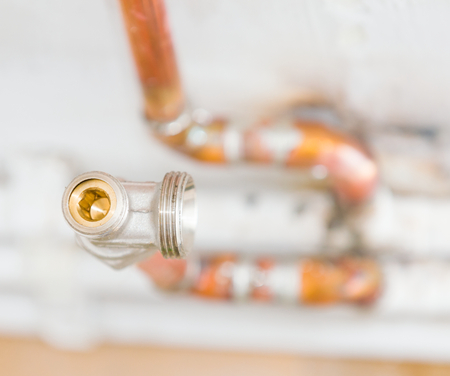 Copper conduit closeup for home heating system before mounting the heater.の写真素材