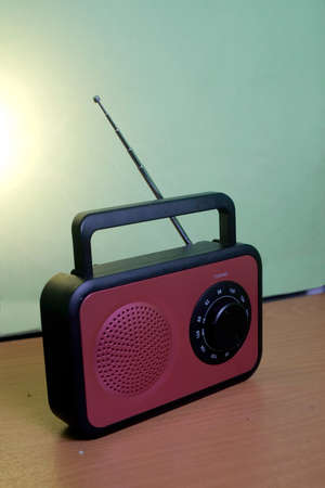 clasic FM radio in red and black with adjusting frequencyの写真素材
