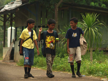 Central Jakarta	Jakarta	Indonesia	-	03/19/2011	:	
three boys with a backpack walking together one of...
