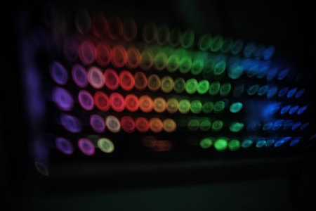 blurry background pic , swirly  linear colorful rounded lights pattern  on blackの写真素材