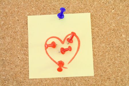 Corkboard with a love - hate messageの写真素材