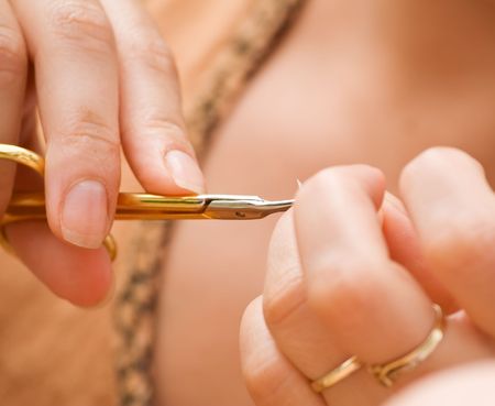 Woman doing her manicure - closeupの写真素材