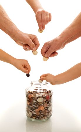 Hands of different generations putting coins in a  glass jar -financial education conceptの写真素材