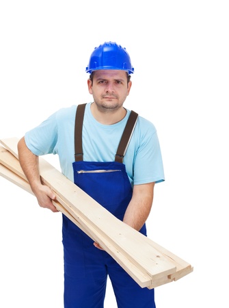 Worker carrying several wooden plancks - isolatedの写真素材