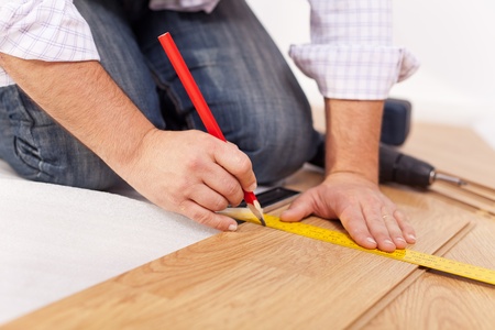 Home improvment - laying laminate flooring, measuringの写真素材