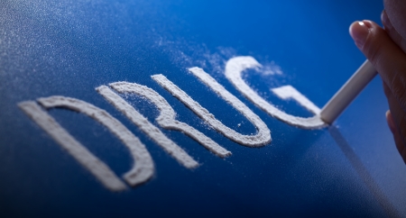 Drug addiction concept - woman sniffing narcoticの写真素材