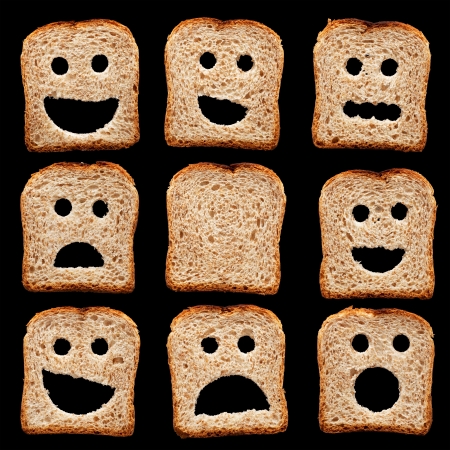 Bread slices with happy sad and other facial expressions - isolated on blackの写真素材