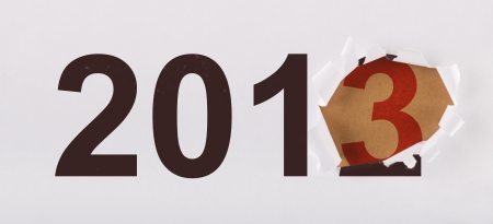 The new year is here - unwrapping 2013 from the previous year packageの写真素材