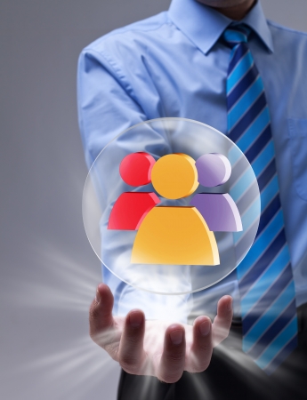 Power of social networking concept with glass sphere over businessman handの写真素材