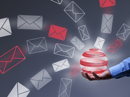 Businessman controlling digital information flow - holding tech bubble radiating mail envelopesの写真素材
